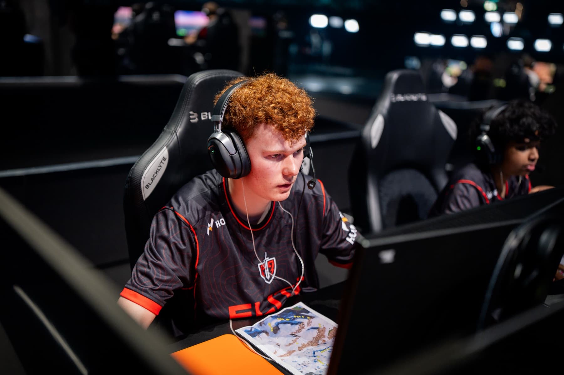 An Elite Fortnite pro dialed in at a tournament station — Hone PC optimization